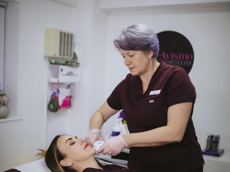 Andrea, registered nurse, treating a client at Avismo Aesthetics and Skin, St Ives, a short drive from St Neots